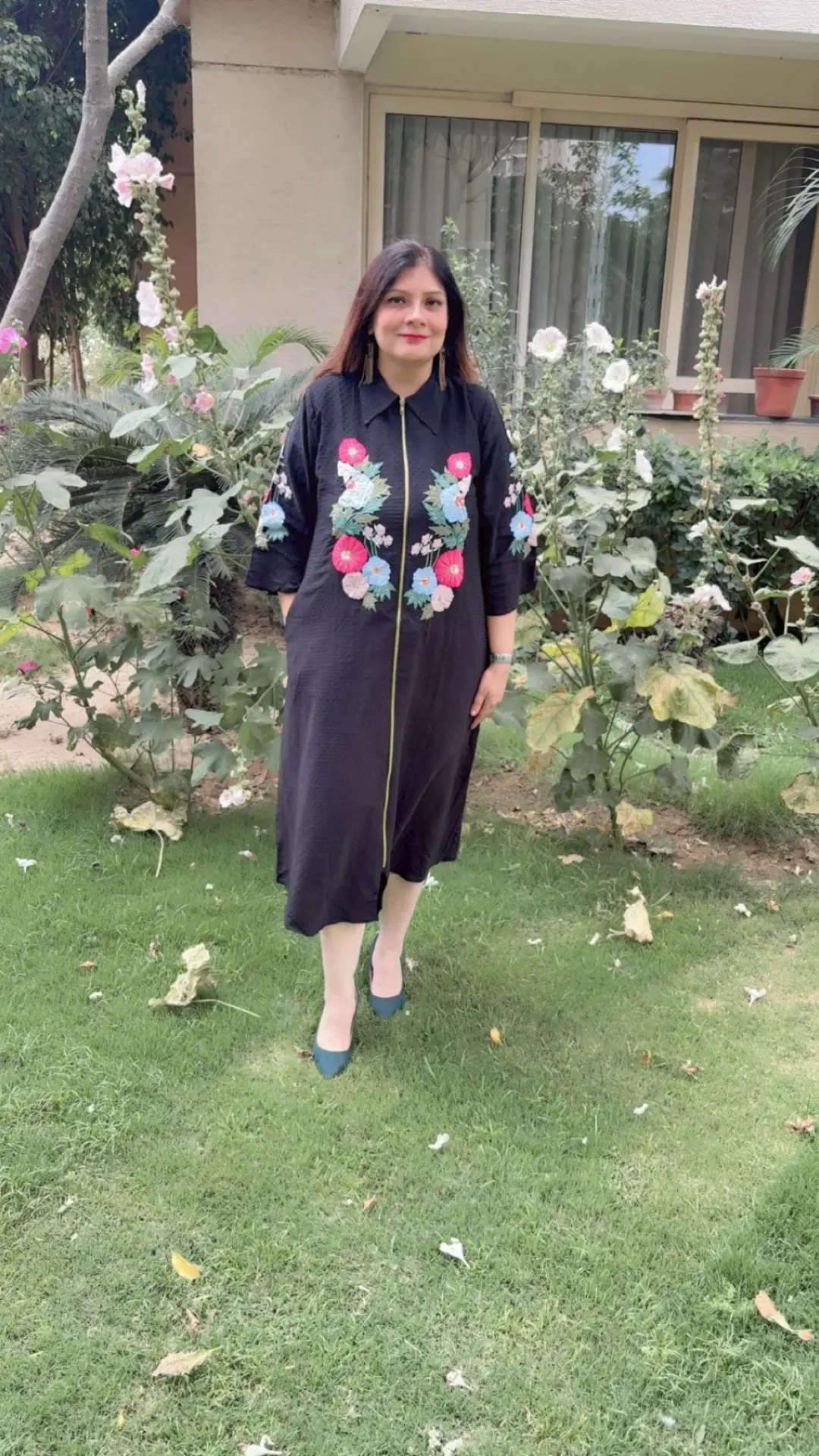 Neha wearing a black floral embroidered shirt dress from Pink Palette